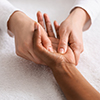 Relaxing hand massage for unrecognizable african lady